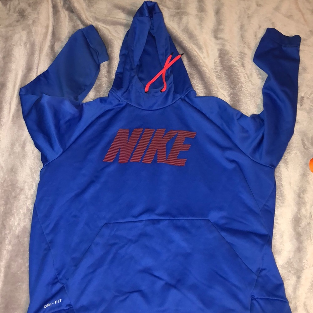 Blue nike hoodie with red Nike written across